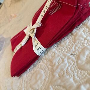 Rae Dunn embroidered holiday napkins. Noel, Peace, Merry and HoHoHo- red